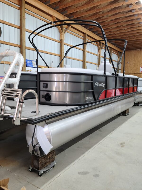 A boat is parked in the middle of a warehouse.