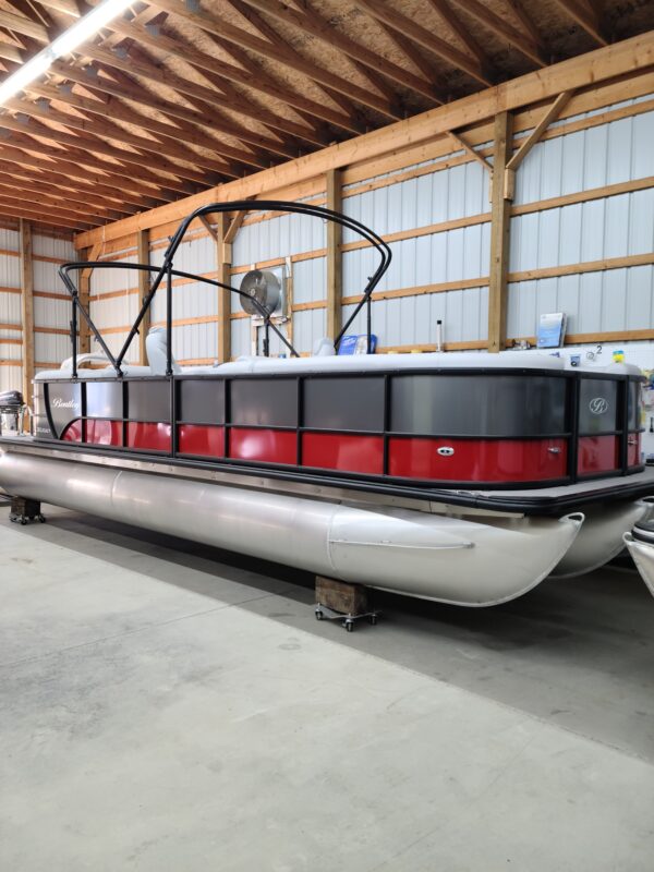 A boat is parked in the middle of a warehouse.