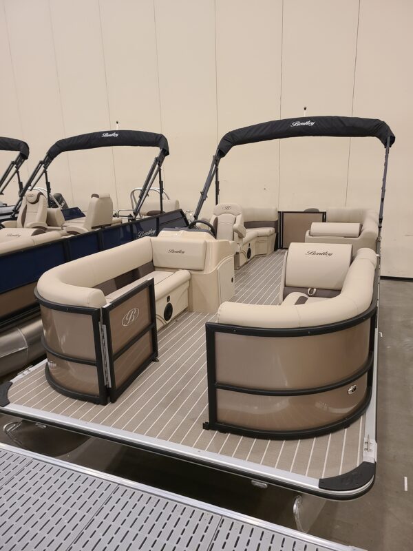 A boat with two couches and one table.