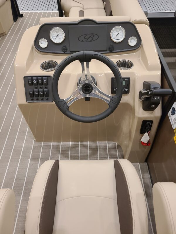 A boat with steering wheel and controls on the front.