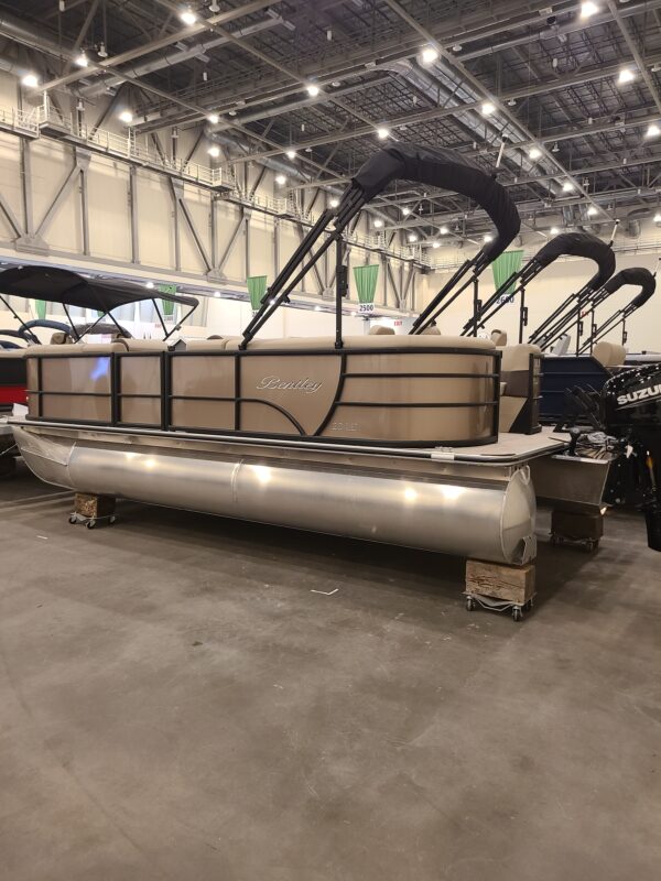 A large metal boat in a warehouse.