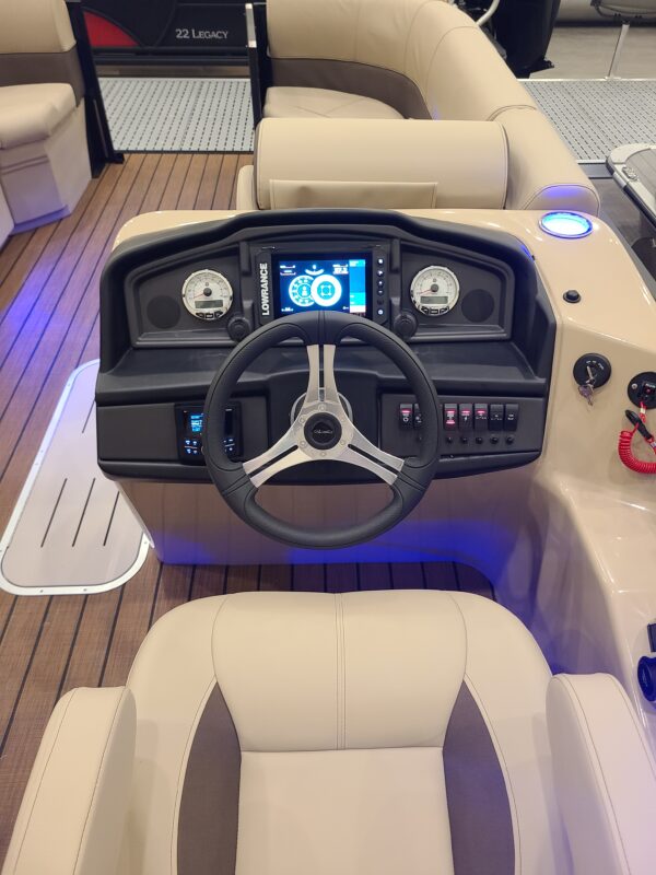 A boat with the steering wheel and controls.