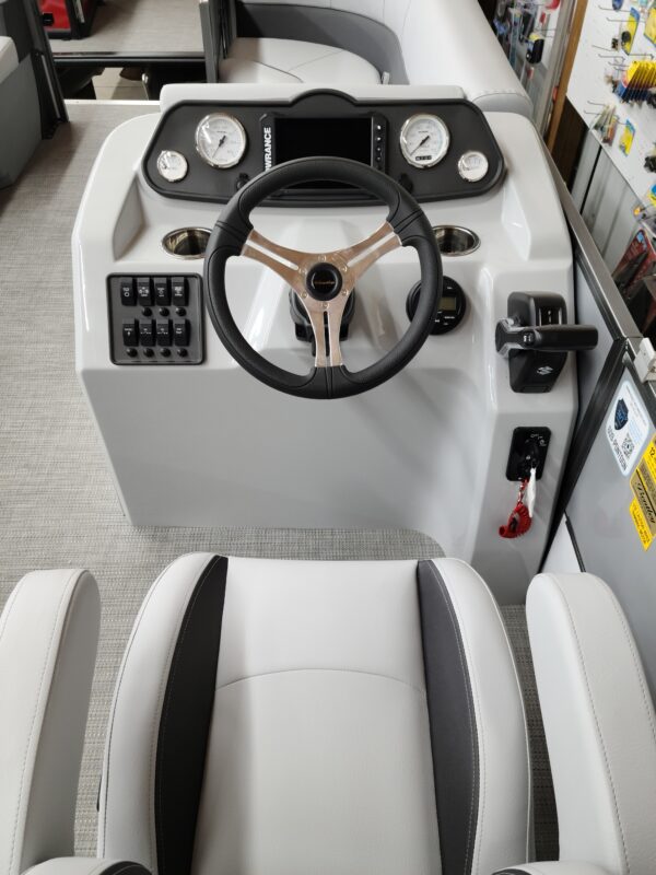 A boat with steering wheel and controls on the front.