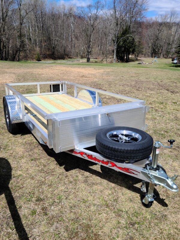 A trailer with a tire on the side of it.