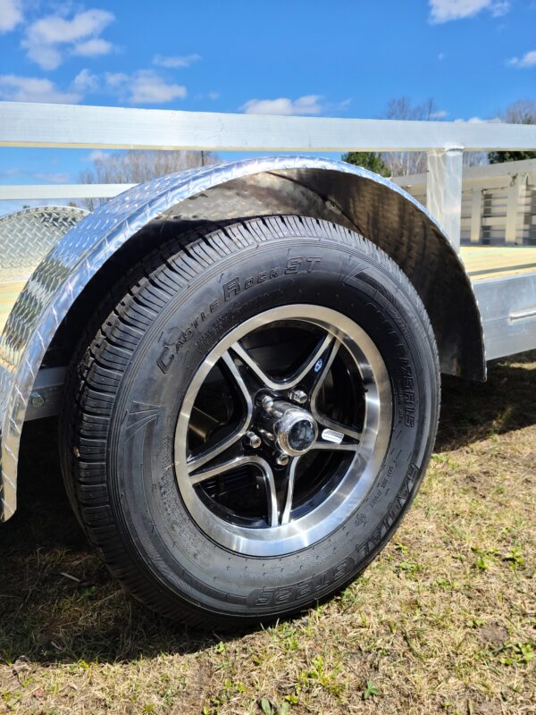 A tire on the back of a trailer.