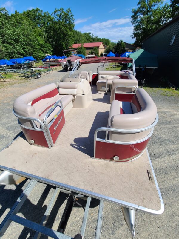 A boat with two seats and a table on top of it.