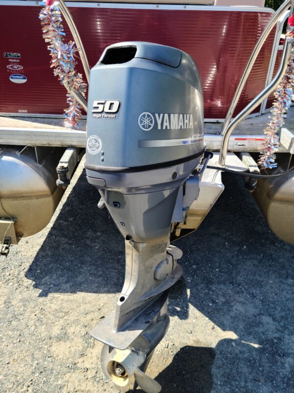 A boat with a yamaha outboard motor on it.