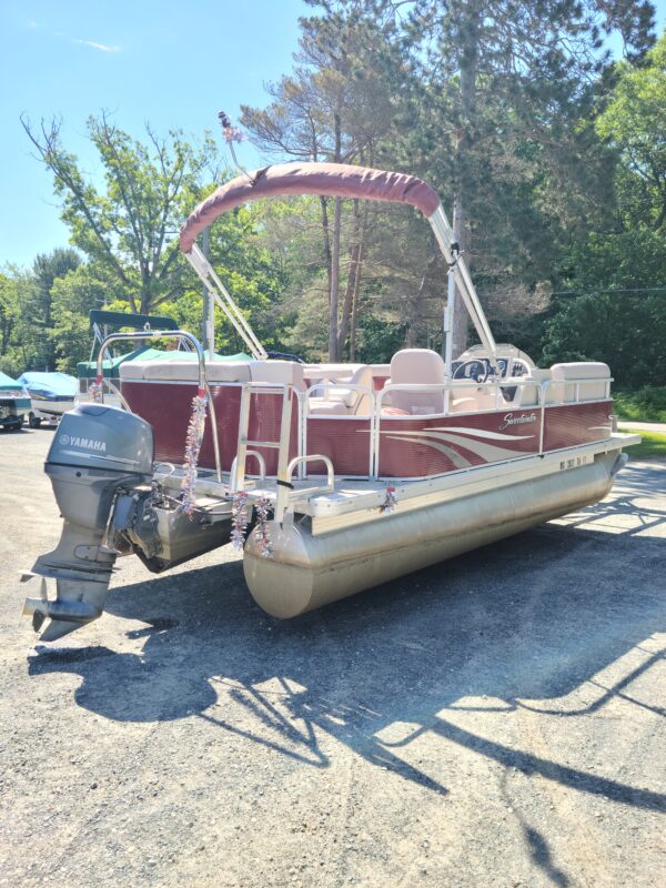 A boat with a large outboard motor on the back.