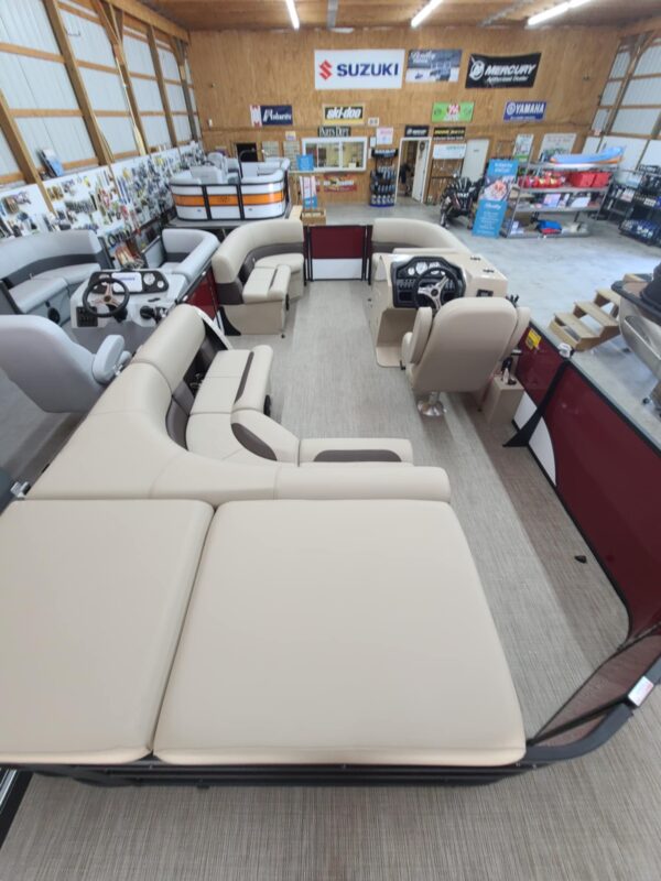 A boat is sitting in the middle of a showroom.