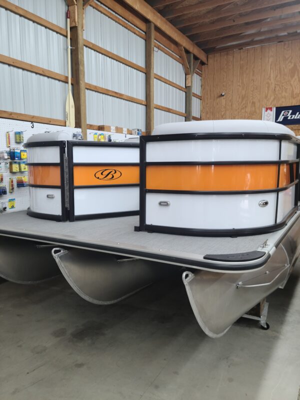 A boat is parked in the warehouse of a store.