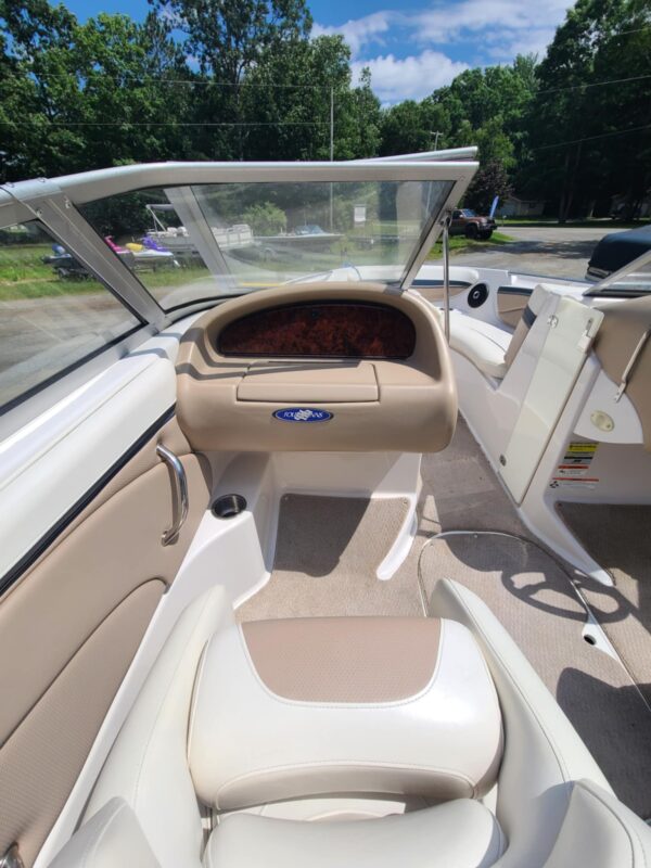 A boat with tan seats and white trim.