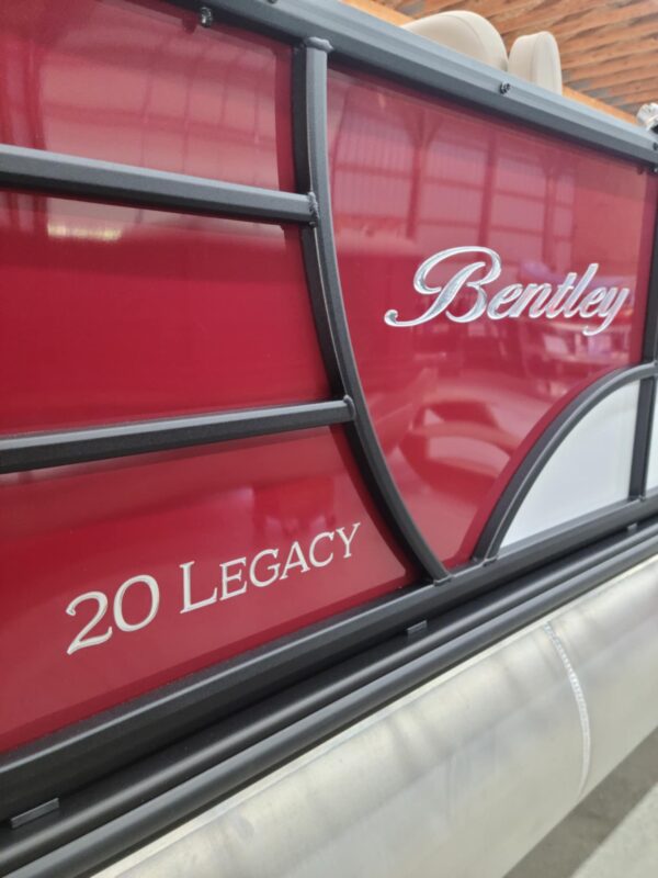 A red bentley truck with the words " 2 0 legacy " written on it.