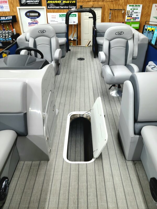 A boat with seats and a hatch in the back.