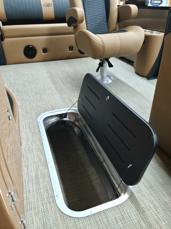 A bench seat with a cup holder and storage compartment.