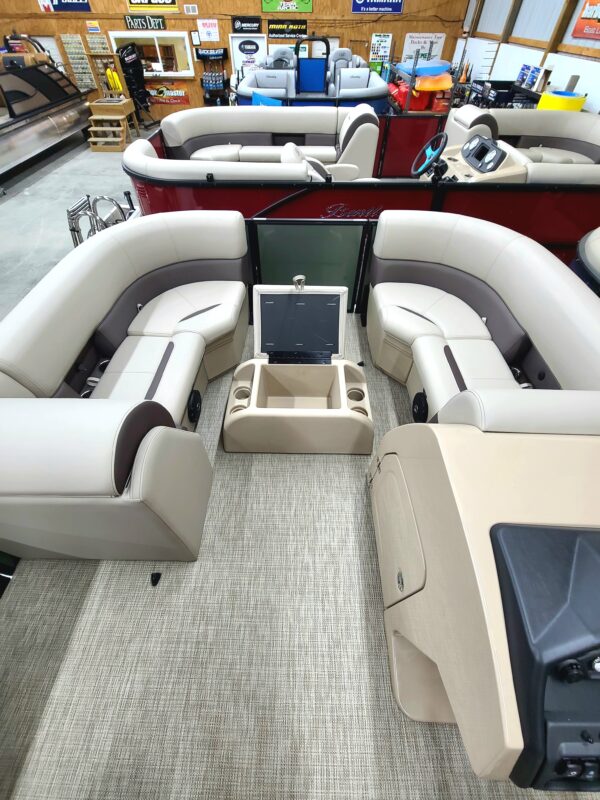 A boat with two seats and a table in the back.