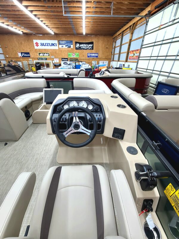 A boat is in the showroom of a store.