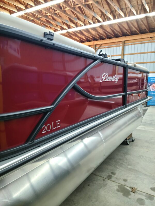 A red boat is parked in the dock.