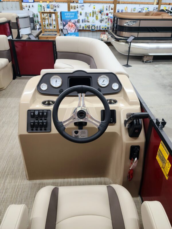 A boat with steering wheel and controls on it.